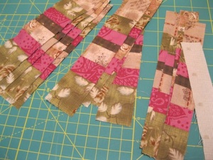 Subcut the strips and add a 1" strip of the light fabric